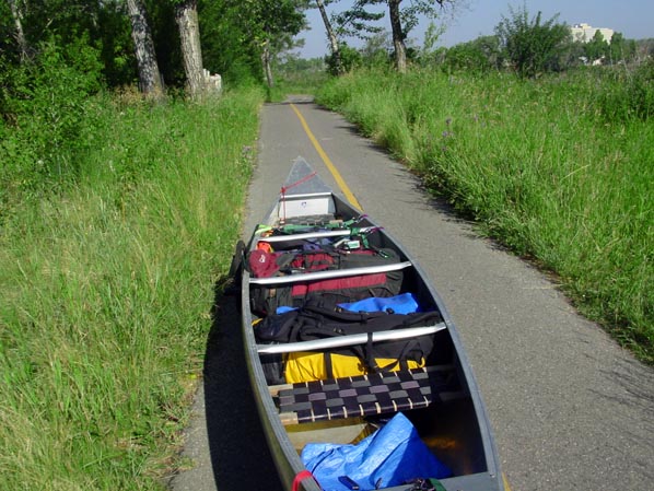 Canoe being towed along cycling path