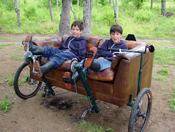 Two boys on the couchbike in Baie-Ste-Anne, New Brunswick